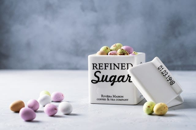 jar that says refined sugar with candies